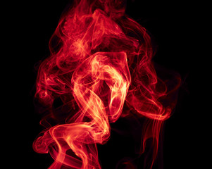 Red smoke on black background