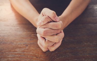 woman praying in morning. Hands folded in prayer