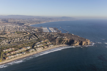 Aerial view of Dana Point shoreline and homes in Orange County California.