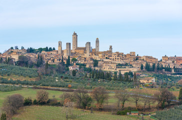 Fototapeta premium San Gimignano (Italy) - The famous small walled medieval hill town in the province of Siena, Tuscany. Known as the Town of Fine Towers, or the Medieval Manhattan. Here the awesome historic center.