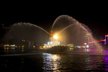 Fototapeta na wymiar Taiwan Keelung Port, Chinese New Year or holidays, the towing vessel will whistle spray water column to celebrate the festival,