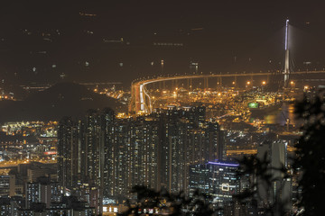 Fototapeta na wymiar Dense high rise apartments in Kowloon peninsula view from Beacon Hill in the evening, Hong Kong