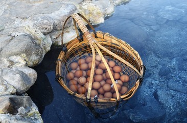 many egg in bamboo basket in hot water in hot springs at Chae Son National Park in Lampang...
