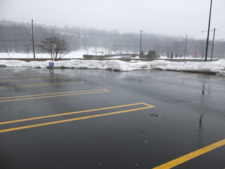 empty parking lot on a snowy day © Michele