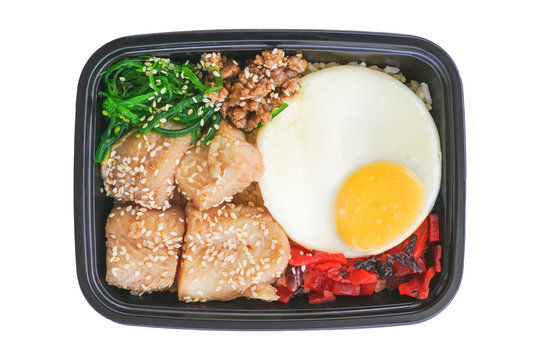 ready meal japaneses cuisine in black tray, fried Pangasius with eggs and rice included clipping path
