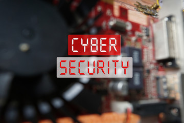CYBER SECURITY CONCEPT : Blurred of a circuit board with big microchip .