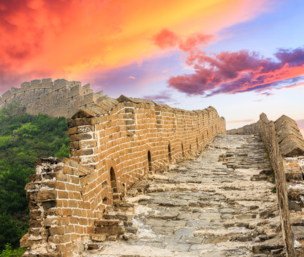 Broken Great Wall of China at sunset landscape