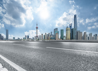 Fototapeta premium cityscape and skyline of shanghai from empty asphalt road.