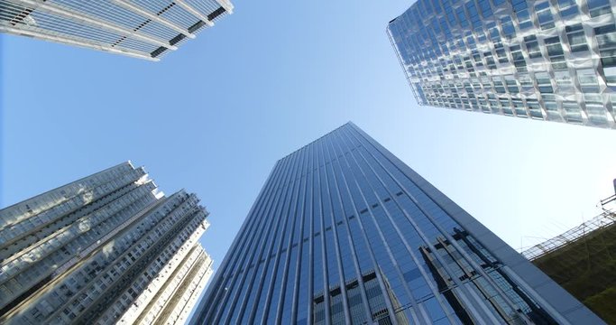 Blue skyscraper from below in rotation