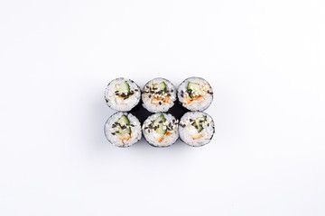 Fresh sushi rolls with eel and cucumber top view.