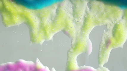 Colorful soap bubbles on grey