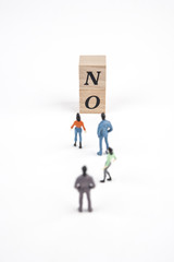 people standing at no lettering cube on white background