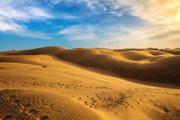 Scenic Thar desert Jaisalmer Rajasthan at sunset with moody sky.