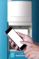Smartphone holding on hands and touch screen with ATM machine background.
