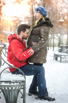 Guy walking on Winter Park with his pregnant girlfriend.