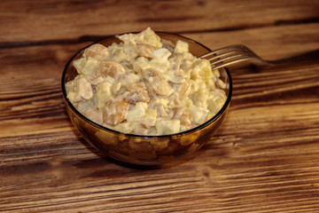 Salad with white kidney beans, potatoes, chicken meat, eggs and mayonnaise