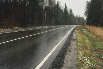 Autumn misty road in Moscow Region, Russia. Low contrast style