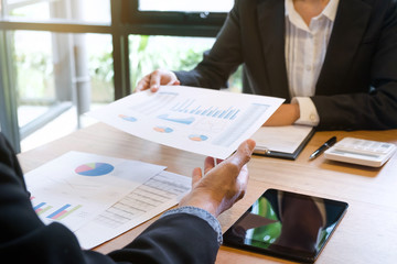 close up of Business executives discussing analyzing performance growth of stock investment fund