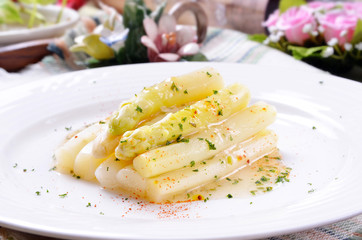  Tasty white asparagus on white plate        