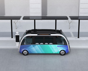 Side view of self-driving shuttle bus waiting at bus station. The bus station equipped with solar panels for electric power. 3D rendering image.