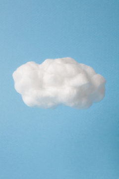 Fototapeta cloud made out of cotton wool on sky blue background