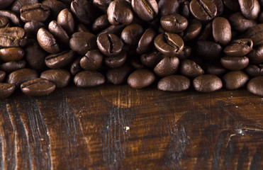 roasted coffee beans on wood texture
