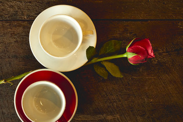 empty cups with red roses