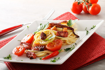 Spaghetti with octopus, cherry tomatoes and hot pepper