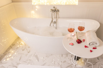 bathtub surrounded with candles, romantic atmosphere