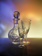 The bright colors on crystal decanter and glasses
