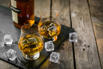 Whiskey on rustic wood background