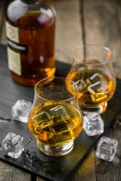 Whiskey on rustic wood background