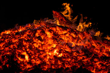 Ignite the fire. Warming up the cold winter nights. A macro shot of firewood and hot, glowing coal....
