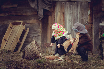 Village children gather wood near the barn