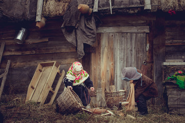 Village children gather wood near the barn