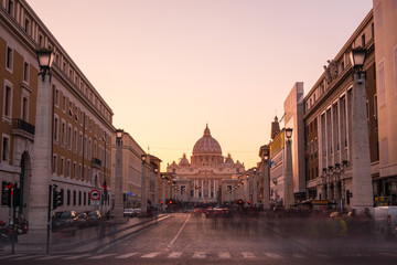 Fototapeta na wymiar VATICAN - ITALY - December 24 2017 - St Peters Basilica at sunset, with golden light and no people.