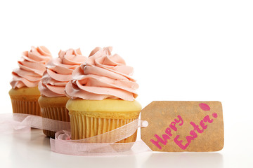 Tasty and beautiful Easter cupcakes isolated on white