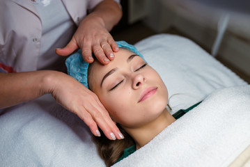 Fototapeta na wymiar Facial massage. Cosmetology.