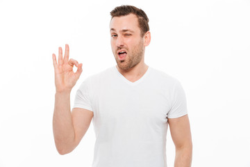 Fototapeta premium Handsome man showing okay gesture.