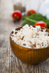 Boiled rice in a wooden bowl