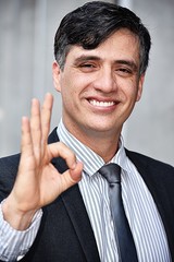 Diverse Business Man And Okay Sign Wearing Suit