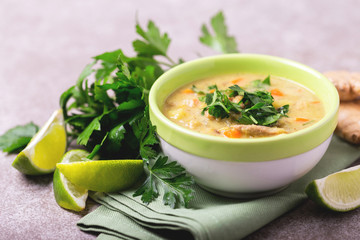 Indian Mulligatawny soup with lentil, parsley. Copyspace, horizontal view.