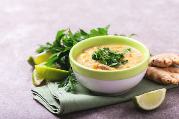Indian Mulligatawny soup with lentil, parsley. Copyspace, horizontal view.
