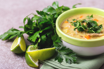 Indian Mulligatawny soup with lentil, parsley. Copyspace, horizontal view.