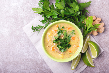 Indian Mulligatawny soup with lentil, parsley. Copyspace, top view.