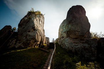 Beautiful landscape. The wooden staircases between two rocks during the sunset.