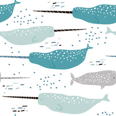 Marine seamless pattern with hand drawn narwhals, Childish texture for fabric, textile, nursery, wrapping. Vector Illustration © solodkayamari