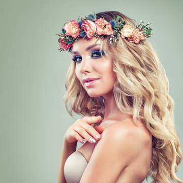 Beautiful Woman with Roses Flowers, Blonde Curly Hairstyle and Healthy Skin on Green Background. Skincare and Haircare Concept