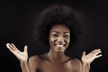 smiling african american woman isolated on black