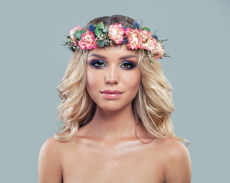 Young Perfect Model with Summer Flowers Wreath and Makeup. Cute Female Face